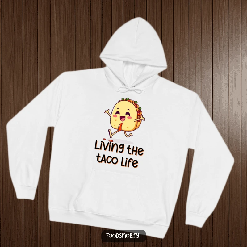 Funny hoodie featuring a happy taco character skipping with salsa, combining warmth with a cheerful, food-loving vibe.