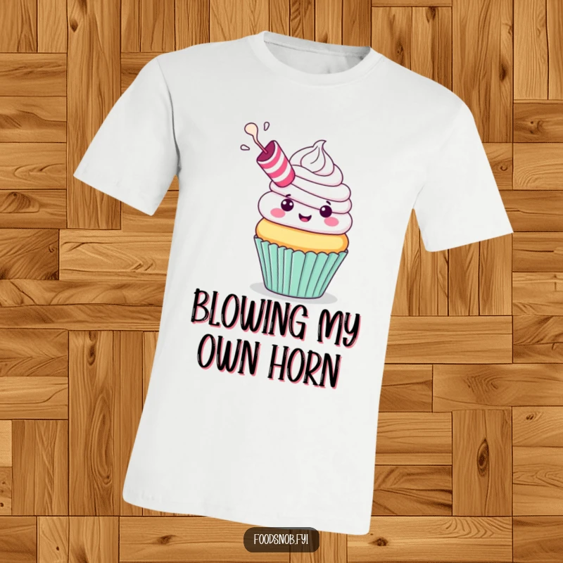 Funny T-Shirt: A cheerful cupcake with a party blower exhaling frosting, embodying festive fun and sweet humor, perfect for a funny gift.